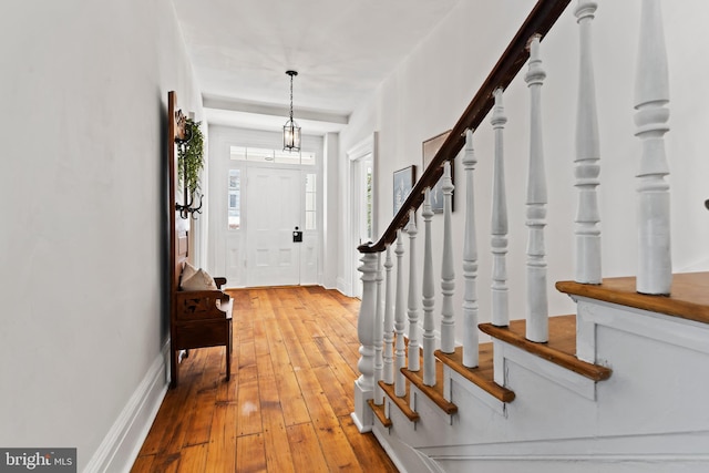 foyer entrance with hardwood / wood-style floors