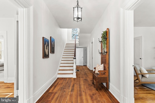 hall with hardwood / wood-style floors