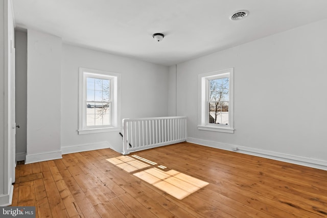 unfurnished room with light hardwood / wood-style flooring