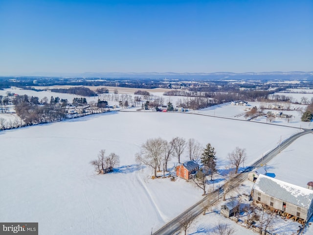 snowy aerial view with a rural view