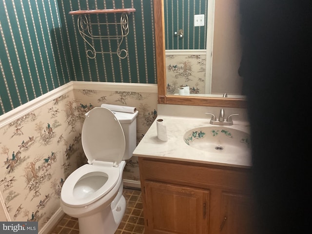 bathroom with tile patterned floors, toilet, and vanity