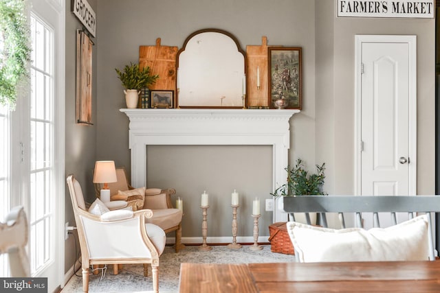 sitting room featuring a fireplace