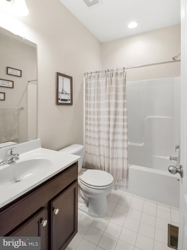 full bathroom with tile patterned floors, vanity, toilet, and shower / bath combo