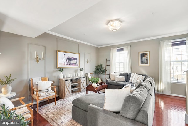 living room featuring crown molding, dark hardwood / wood-style floors, and a wealth of natural light