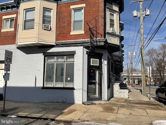 view of building exterior with cooling unit