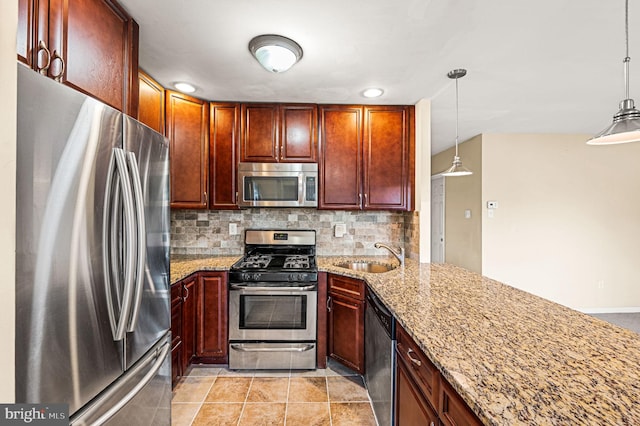 kitchen with stainless steel appliances, light stone countertops, backsplash, and decorative light fixtures