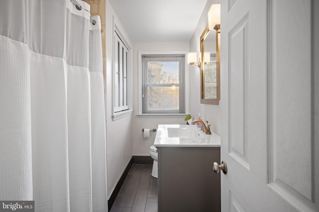 bathroom with vanity and toilet