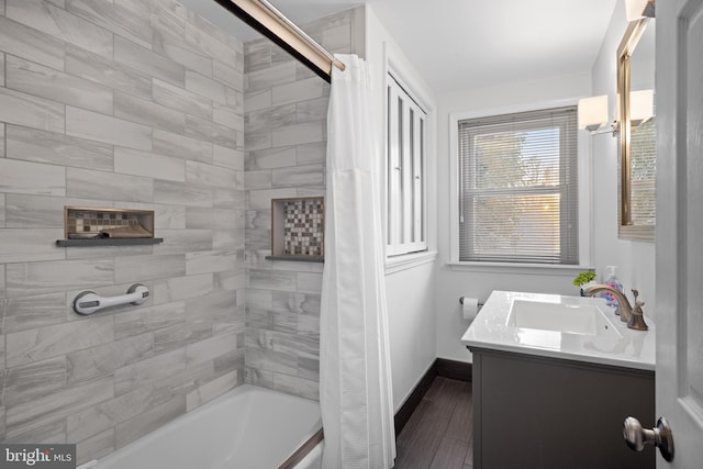 bathroom featuring vanity and shower / bath combo with shower curtain