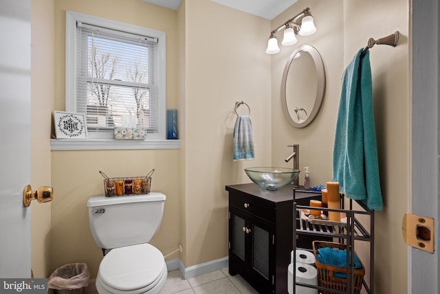 bathroom with vanity, tile patterned floors, and toilet