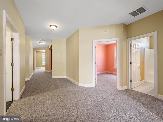 hallway with light carpet