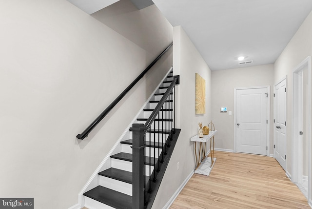 foyer entrance with light wood-type flooring