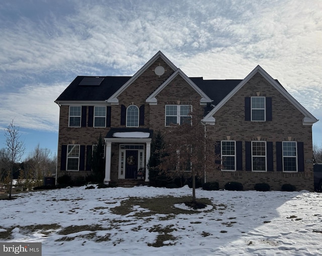 colonial-style house with cooling unit