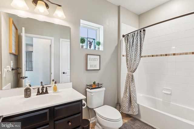 full bathroom with vanity, shower / tub combo with curtain, and toilet