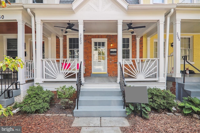 entrance to property with covered porch and ceiling fan