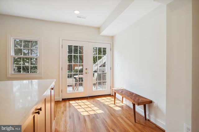 doorway featuring french doors and light wood-type flooring