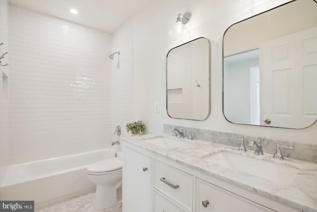 full bathroom with bathing tub / shower combination, vanity, and toilet