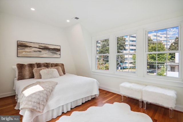 bedroom with wood-type flooring