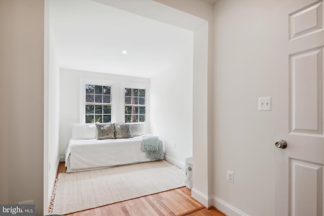 unfurnished room with hardwood / wood-style flooring