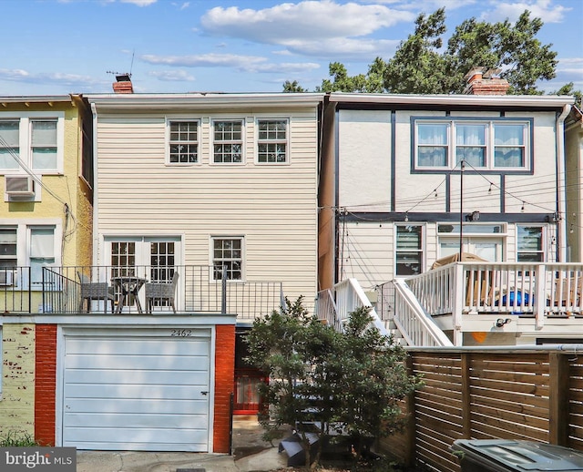 back of house with a garage