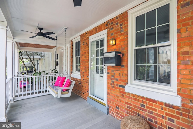 deck featuring ceiling fan and a porch