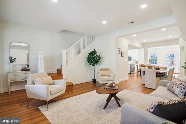 living room with light hardwood / wood-style flooring