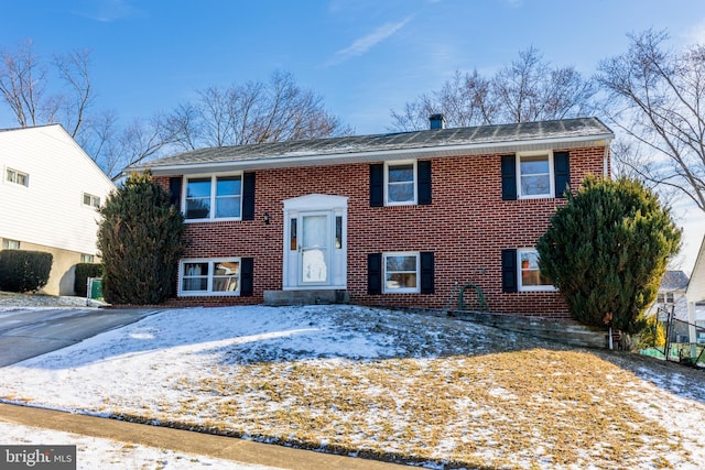 raised ranch with brick siding