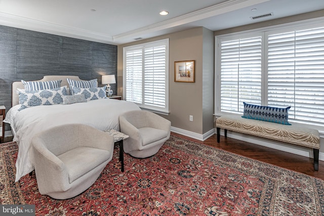 bedroom featuring recessed lighting, dark wood-type flooring, visible vents, baseboards, and crown molding