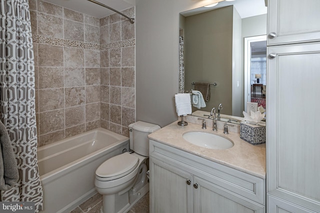 bathroom featuring shower / bath combo, vanity, and toilet