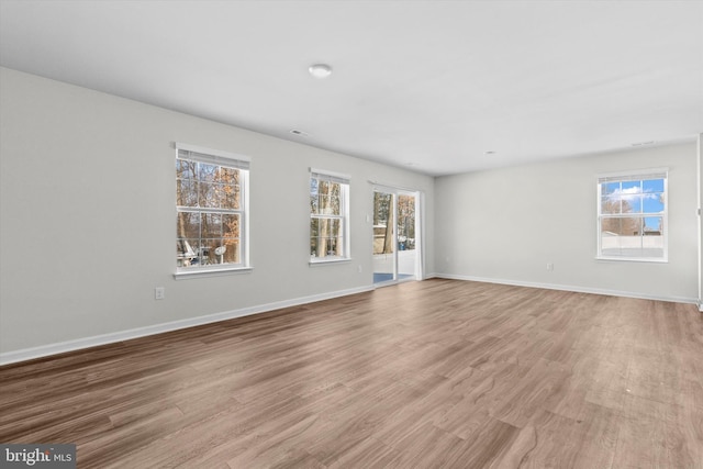 spare room featuring light hardwood / wood-style floors