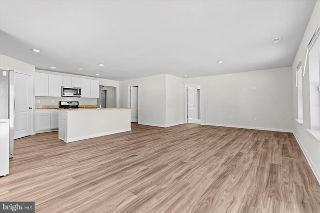 unfurnished living room featuring light wood-type flooring