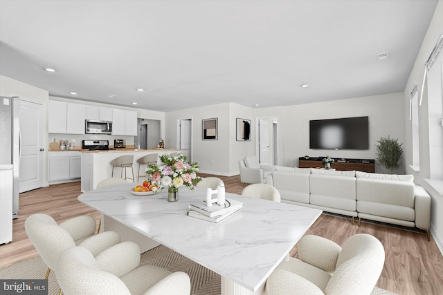 dining room featuring light hardwood / wood-style flooring