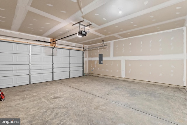 garage featuring a garage door opener and electric panel