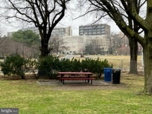 view of property's community with a lawn