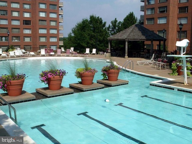 view of pool featuring a gazebo and a patio area