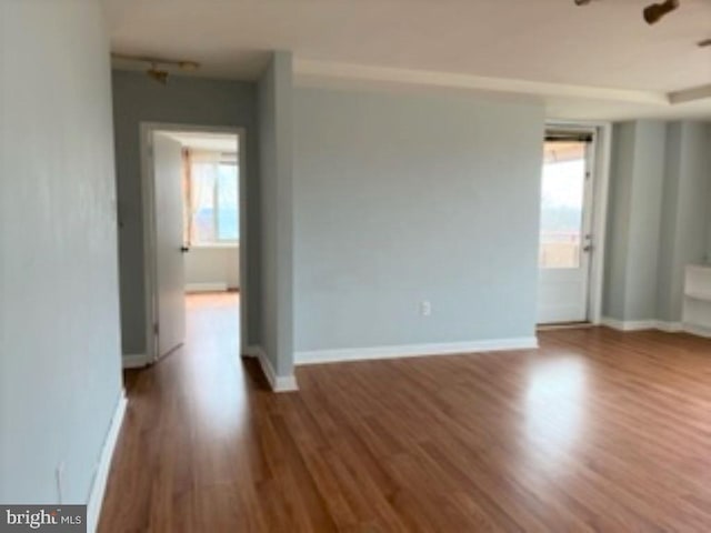 unfurnished room featuring hardwood / wood-style flooring