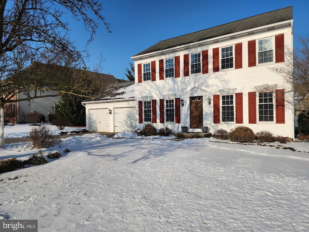 colonial-style house with a garage