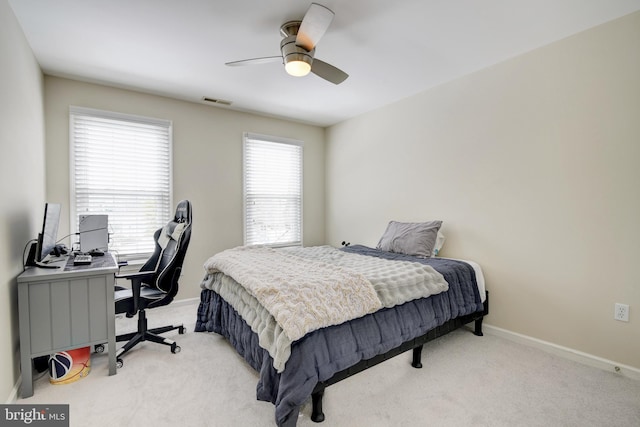 bedroom with light carpet and ceiling fan