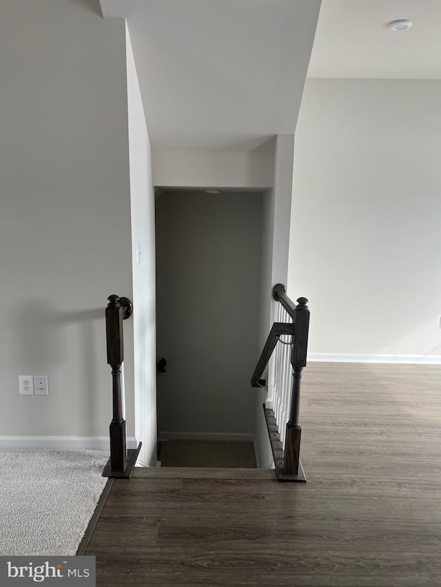 stairway featuring hardwood / wood-style floors