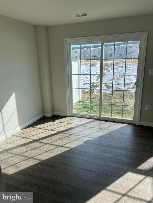 empty room with a healthy amount of sunlight and light wood-type flooring