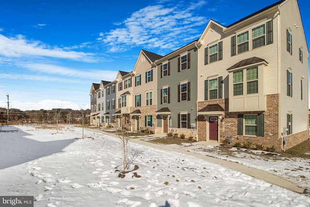 view of snow covered property