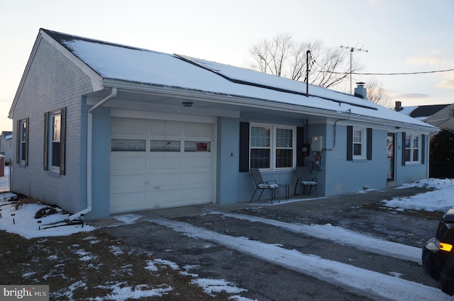 single story home with a garage