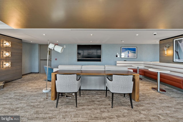 interior space featuring wood walls, carpet flooring, and recessed lighting