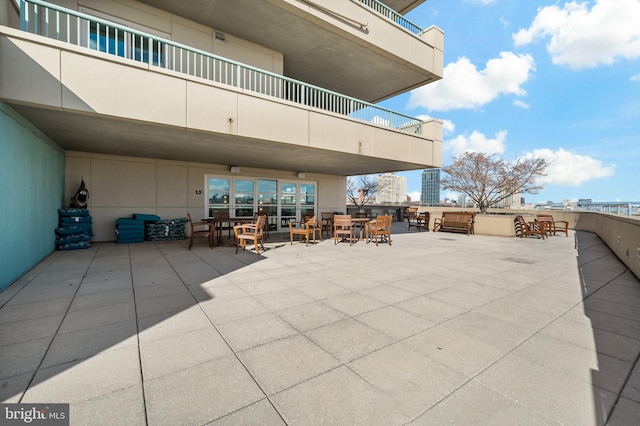 view of patio / terrace with outdoor dining area and a balcony