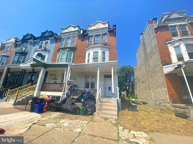 multi unit property featuring a porch