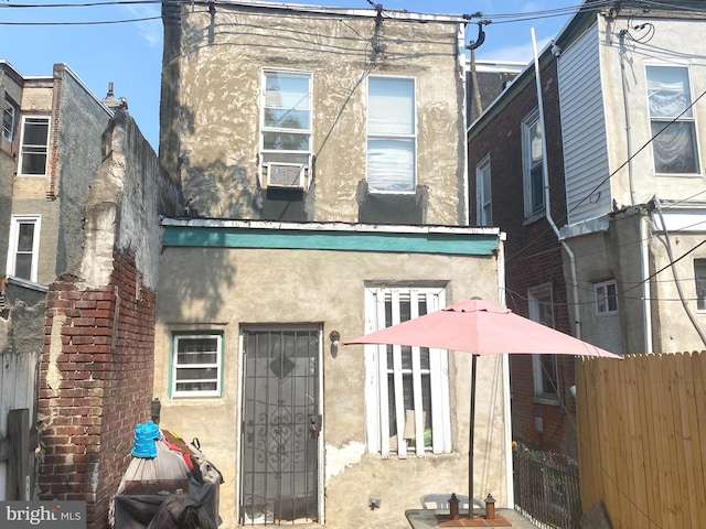 rear view of house with cooling unit