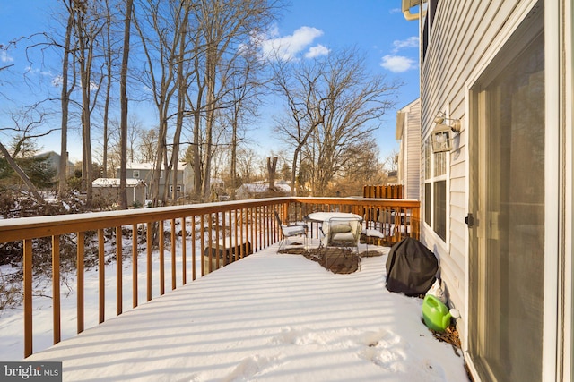 view of snow covered deck