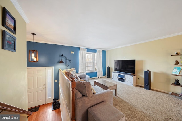 living room with crown molding and hardwood / wood-style floors