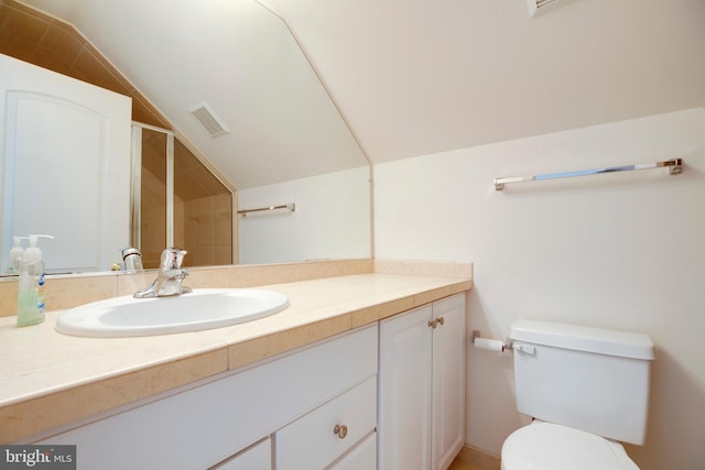 bathroom with visible vents, an enclosed shower, vaulted ceiling, vanity, and toilet