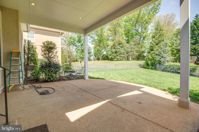 view of patio featuring fence