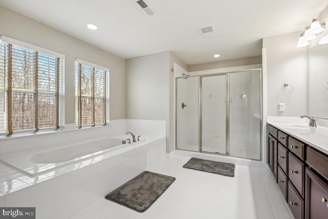 bathroom featuring vanity, visible vents, a stall shower, tile patterned flooring, and a garden tub